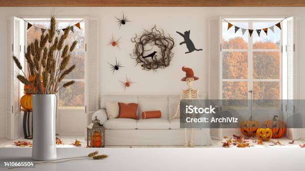 White Table Top Or Shelf With Straws Dry Plants Ornament Ears Sheaf Branch In Vase Over Halloween Living Room With Fireplace And Autumnal Landscape Classic Interior Design Stock Photo - Download Image Now