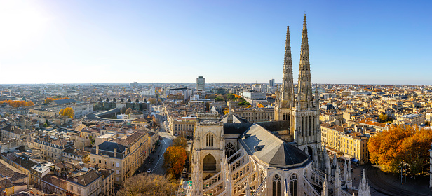 Stunning panoramic aerial cityscape from Pey Berland tower of St. Andrew's Cathedral beautiful sunny evening of warm golden autumn, Bordeaux, Gironde, Nouvelle-Aquitaine, France.