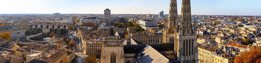 Stunning panoramic aerial cityscape from Pey Berland tower of St. Andrew's Cathedral beautiful sunny evening of warm golden autumn, Bordeaux, Gironde, Nouvelle-Aquitaine, France.