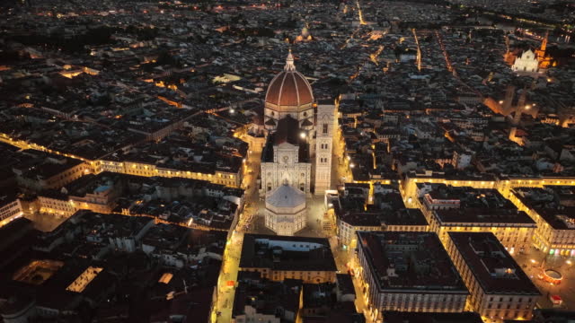 Aerial drone Sunset scene view of Firenze old town and Piazza del Duomo in Florence, Italy. Duomo di Santa Maria del Fiore, the famous Cathedral of Florence