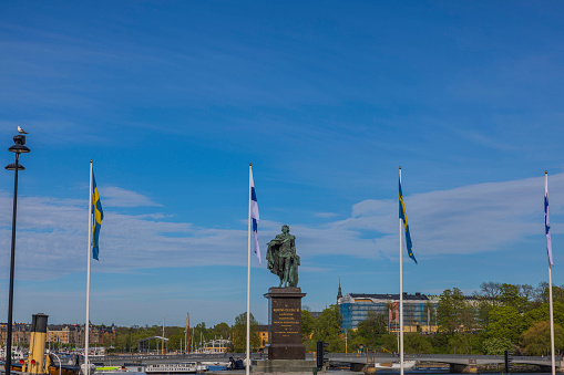 Sweden. Stockholm. 05.18.2022. Beautiful view of Swedish and Finnish flags at royalty place of Stockholm.