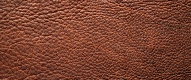 istock natural leather texture background, brown cowhide closeup 1410669424