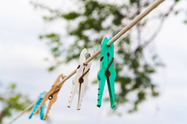 istock Clothespins for drying clothes on a rope. Clothesline . 1410669432