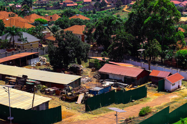 Sunny Ugandan Landscape with construction yard , Kampala, houses and construction, blue sky