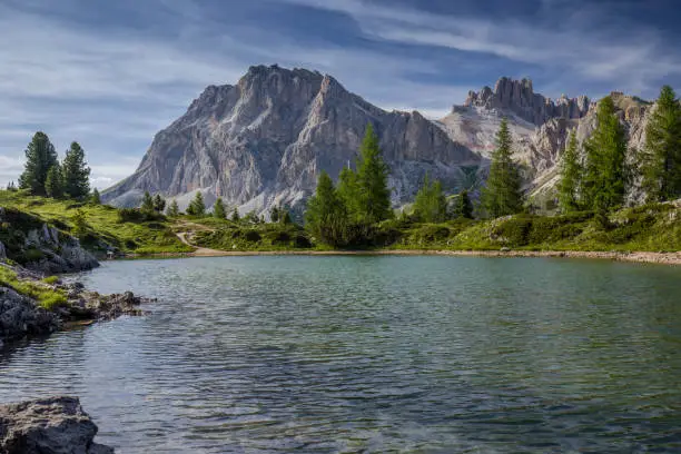Bewitching landscape of Italian Dolomites during summer. On the foreground small mountain lake Lago di Limides
