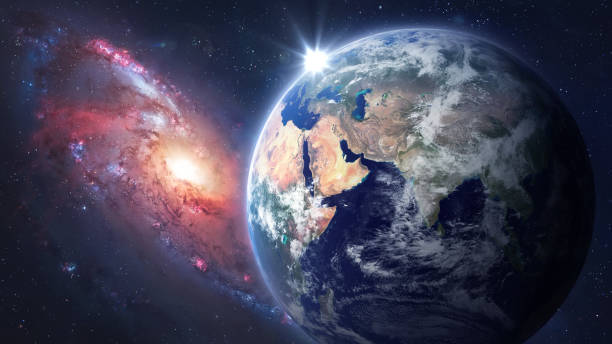 istock Earth planet in space. Spiral galaxy in deep space. Solar system exploration. Elements of this image furnished by NASA 1410670519