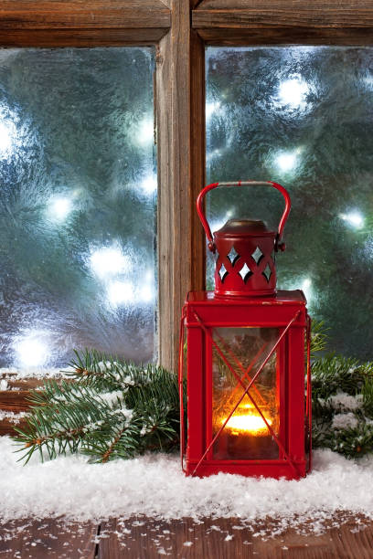 istock Christmas composition with lantern and frost window, selective focus 1410671087
