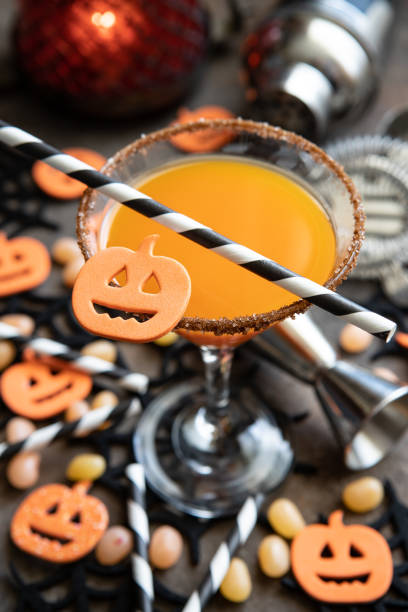 istock Autumn pumpkin cocktail with Halloween decor on  dark  background 1410674547