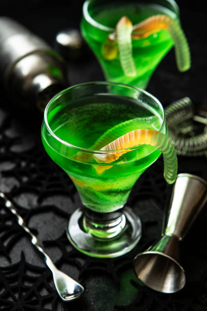 istock Green witch drink  in glass with ghost, Halloween food idea 1410674554
