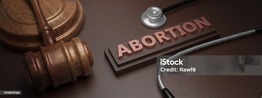 Abortion law and Health. Legal or illegal. Text, medical stethoscope and judge gavel. 3D Render Text and judge gavel. 3D Render Abortion law and Health concept. Pregnancy termination Legal or illegal. Text, medical stethoscope and judge gavel on wooden table. 3D Render Abortion Stock Photo