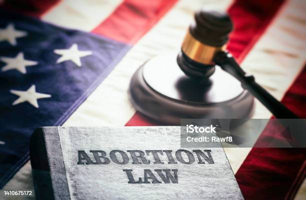 Abortion Law In Usa Concept Pregnancy Termination Ban Judge Gavel And Abortion Law Book On Us Flag Stock Photo - Download Image Now
