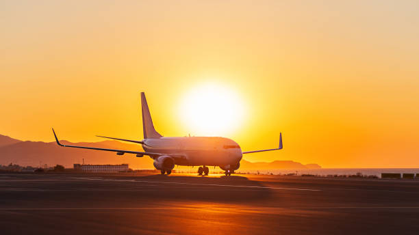 istock Private jet on runway airport at sunset 1410675752