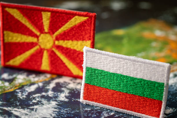 Flags of Bulgaria and North Macedonia straight in front of each other, The concept of complicated relations between the two countries Flags of Bulgaria and North Macedonia straight in front of each other, The concept of complicated relations between the two countries north macedonia stock pictures, royalty-free photos & images