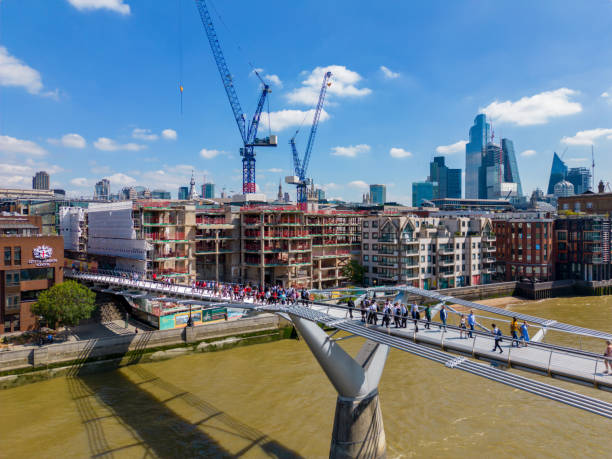 London, UK - July 8, 2022: People walking on the Millennium Bridge London UK