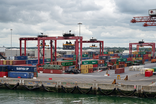 Dublin, Ireland- July 7, 2022: Shipping containers and cranes in Dublin Port