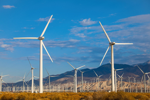 View of wind turbines generating energy in the desert