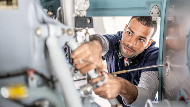 istock Aviation mechanic repairing jet, inside of engine view 1410686370