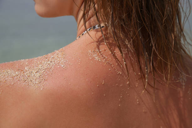 Woman's hair on the beach. Wet hair close up image. Hair damage due to salty ocean water and sun, summertime hair care concept. stock photo