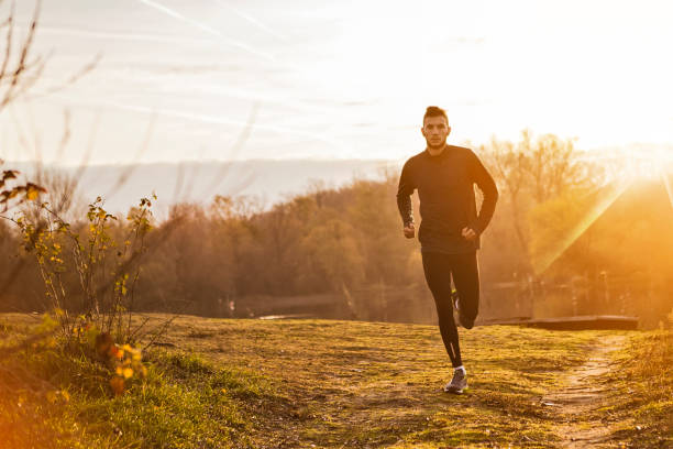 istock Young man runner athlete running in a park in morning time 1410690505