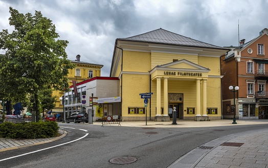 Bad Ischl, Austria, July 8, 2022: View of the Lehar Film Theater in this town in Upper Austria under cloudy sky. There are salt baths in Bad Ischl. The town is known also as the place where the Austrian Emperor Franz Joseph I had a villa.