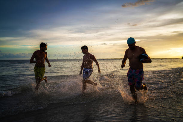 istock Boys running on the beach in Florida 1410692689