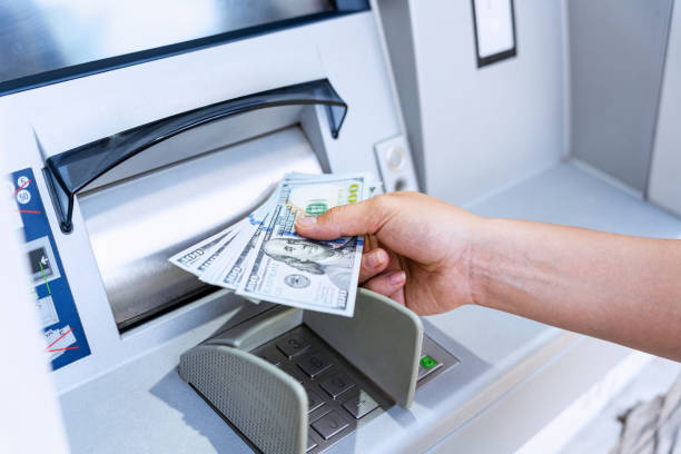 Atm machine money cash. Holding american bill cash. Woman withdraw money usd hundred dollar. Us dollar bill, bank credit card. Atm machine money cash. Holding american bill cash. Woman withdraw money usd hundred dollar. Us dollar bill, bank credit card cashpoint stock pictures, royalty-free photos & images