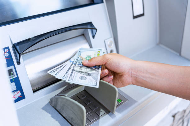 atm machine money cash. holding american bill cash. woman withdraw money usd hundred dollar. us dollar bill, bank credit card. - multibanco imagens e fotografias de stock