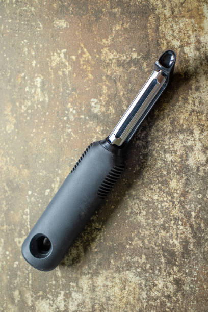 istock top down view of a metal potato peeler 1410695074