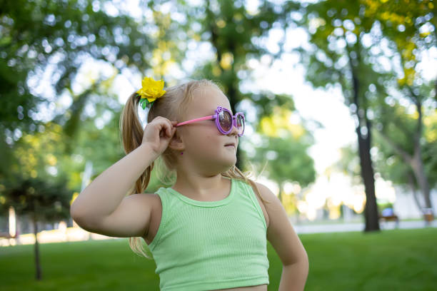 istock little girl model in the park 1410696965
