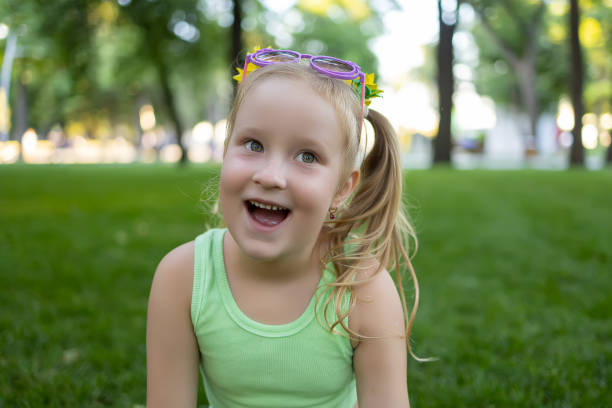 istock little girl model in the park 1410696973