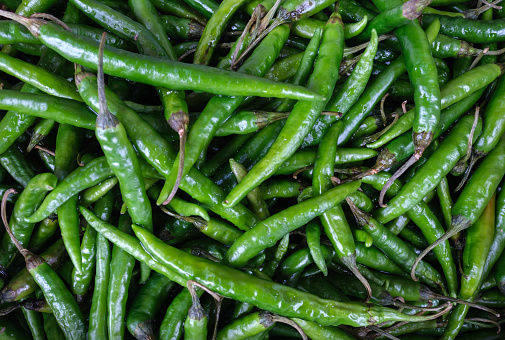 Background Texture Of Green Chili (Chilli) Peppers At A Market