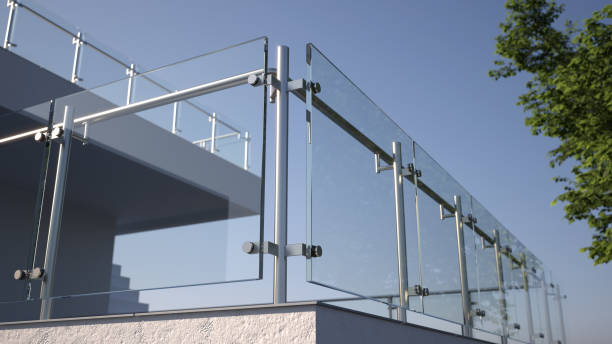 istock Modern stainless steel railing with glass panel and house, 3D illustration 1410700509