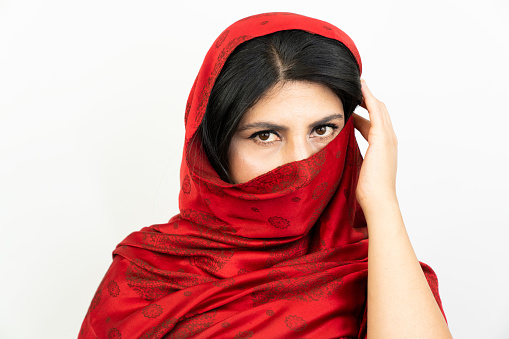 middle eastern woman with red scarf, white background