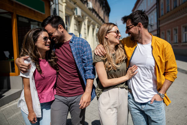 istock Friends walking on the street having fun 1410702343
