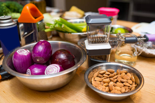 a set of raw products ready for cooking, displayed on the kitchen table (products and cooking utensils) stock photo