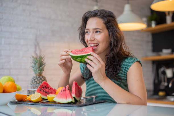 istock Woman eating a healthy breakfast 1410710150