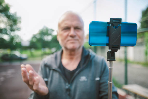 istock Active senior man recording video 1410712684