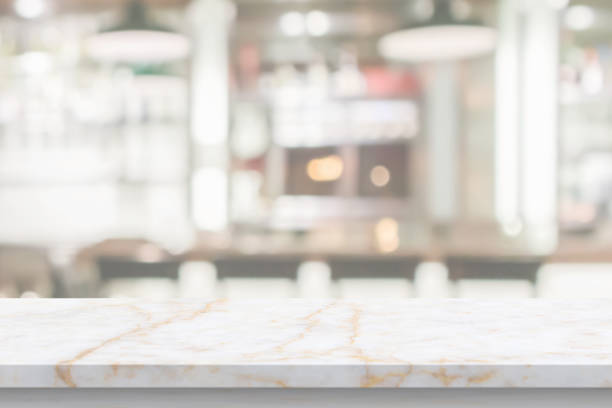 istock marble table top with blurred kitchen cafe restaurant interior background 1410713371