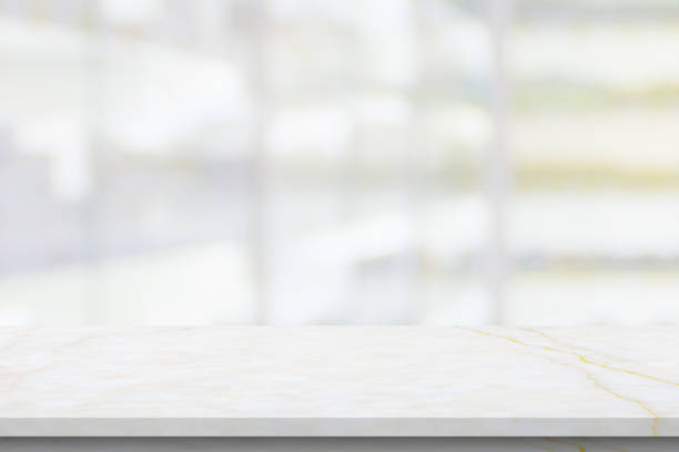 istock Empty white marble counter top with blur pharmacy drugstore shelves background 1410713412