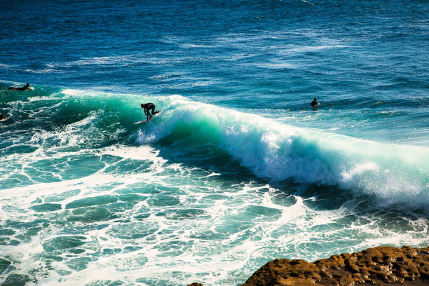Santa Cruz, United States - January 27 , 2013 : Surf capitol of the US. Only the bravest surfest dare to ride these waves.