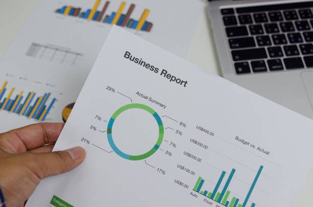 istock Business document chart report financial and graph statistic analysis management information and research investment plan sale on desk at office. 1410714116