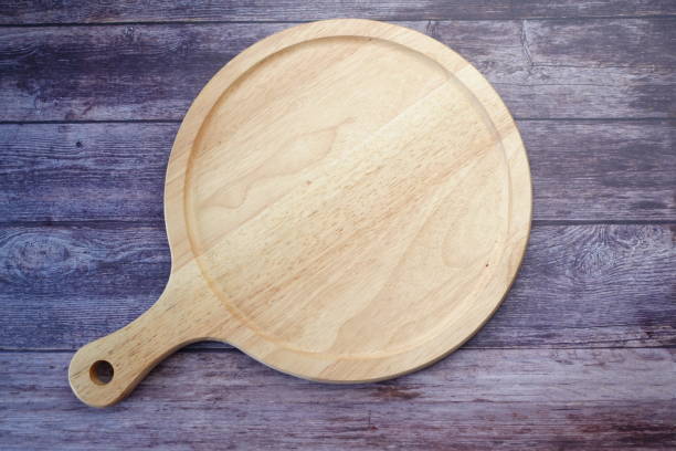 istock wooden chopping board on table top down 1410716480