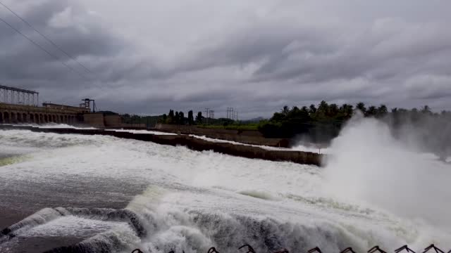 Ferocious waters gushing out of the water gates of the Krishna raja sagar dam built over 2 centuries ago near Mysore city in India.