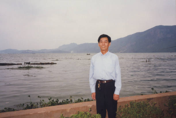 istock 1990s Chinese Men Real Life Old Photo 1410724076