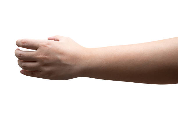 istock isolated of a woman's hand holding something. 1410724411