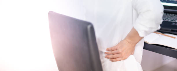 istock Asian young feeling pain from work, while sitting in front of a laptop in their home. Concept working woman office syndrome. 1410727921