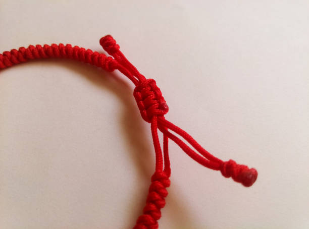 red rope bracelet - nylon strings imagens e fotografias de stock