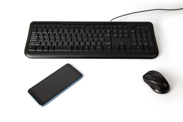 istock black keyboard and mouse smartphone isolated on white background 1410735438