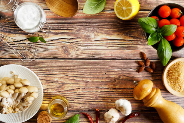 istock Frame of assorted food ingredients on rustic wooden table. 1410735662