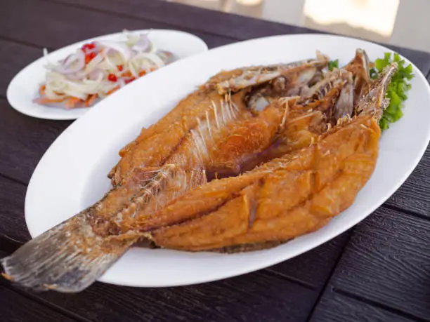 Photo of Deep Fried Sea Bass with Fish Sauce,Fried snapper with fish sauce.